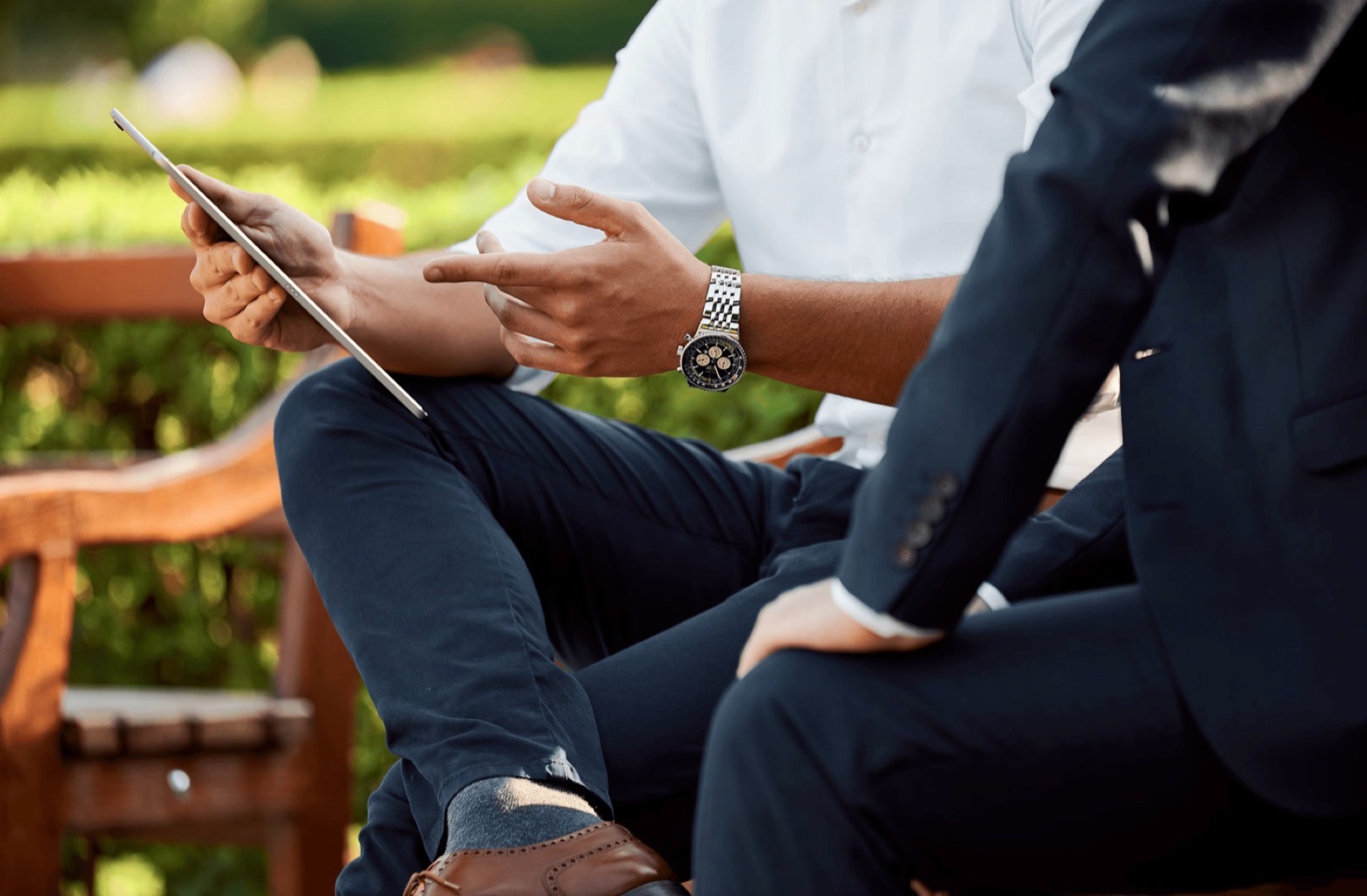 Advisors reviewing a sales plan on a tablet
