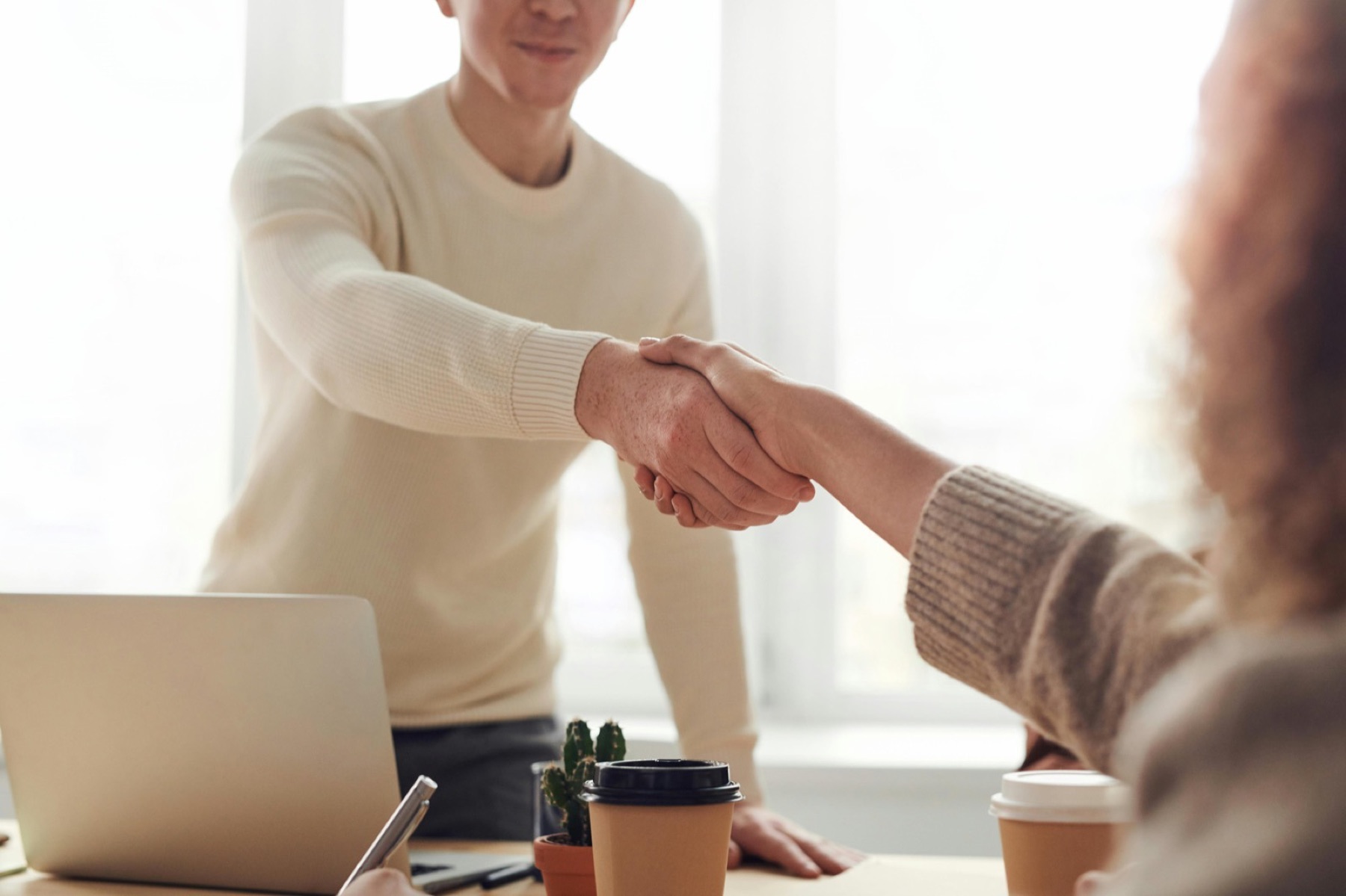 Partners shaking hands to close a deal